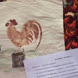 May include: A craft kit for making a rooster pot holder. The kit includes a piece of fabric with a rooster design, a piece of fabric with a chicken pattern, a bag of seed, a piece of orange string, and instructions. The instructions include the text "Pot Holder - Not Mat Kit".