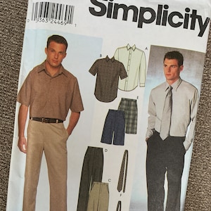 May include: Simplicity sewing pattern number 9469 for size AA, 38, 40, 42, and 44. The pattern includes instructions for making a shirt and pants. The pattern shows a man wearing a light brown shirt and beige pants, and another man wearing a white shirt with a dark tie and black pants.