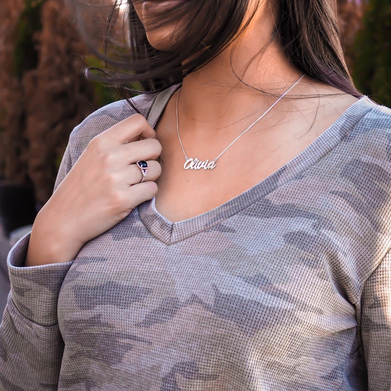 silver name necklace showing the length on a woman