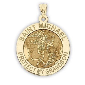 May include: Gold-toned pendant featuring a depiction of Saint Michael the Archangel defeating Satan, with the inscription "Saint Michael Protect My Grandson".