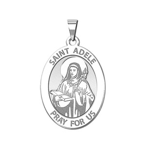 May include: Silver oval pendant with a raised image of Saint Adele holding a book and a flower. The pendant has the words "Saint Adele" and "Pray for Us" around the image.