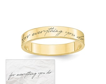 May include: A gold band ring with the inscription "for everything you do" engraved on the outside of the band.
