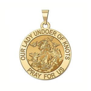 May include: Gold-toned pendant featuring a depiction of the Virgin Mary untying knots, surrounded by angels and the text "Our Lady Undoer of Knots Pray For Us".
