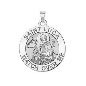 May include: A silver Saint Luca pendant with the words "Saint Luca Watch Over Me" engraved around the edge. The pendant features an image of Saint Luca holding a paintbrush and a bull.