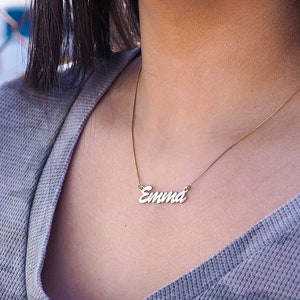 Emma name necklace in silver on a females neck