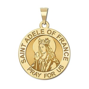 May include: Gold-toned pendant featuring a depiction of Saint Adele of France, with the inscription "Saint Adele of France Pray for Us".