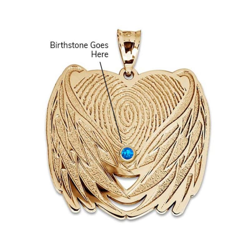 May include: Gold pendant featuring a fingerprint design with angel wings. A blue gemstone is set in the centre of the fingerprint.