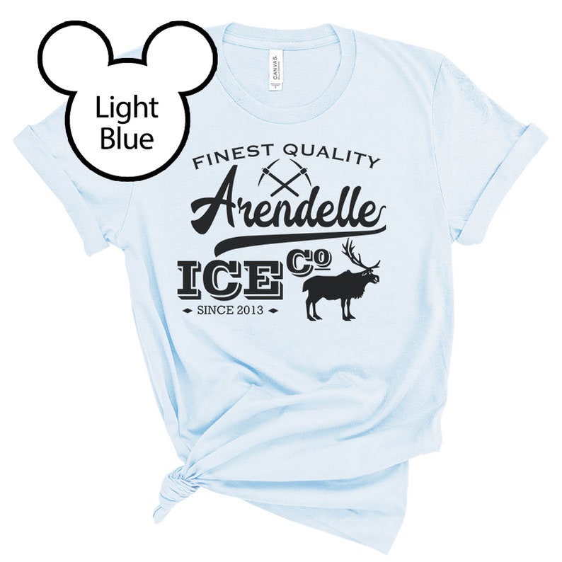 May include: Light blue t-shirt with a black graphic design that says "Finest Quality Arendelle Ice Co. Since 2013". The graphic also includes a pair of crossed pickaxes and a cartoon reindeer.