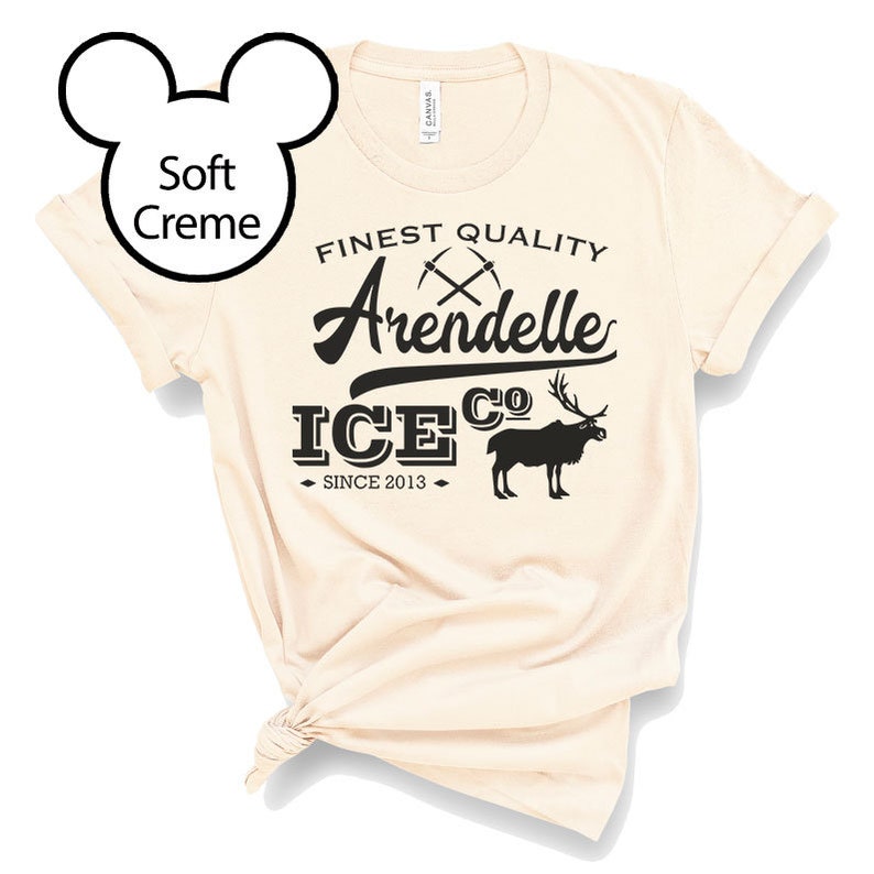 May include: A soft creme t-shirt with a black graphic that says "Finest Quality Arendelle Ice Co. Since 2013" with a stylized ice pick and a reindeer.