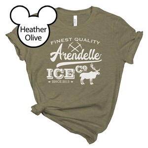 May include: A heather olive t-shirt with a white graphic design that says "Finest Quality Arendelle Ice Co. Since 2013". The graphic also includes a pair of crossed pickaxes and a reindeer.