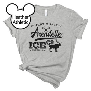May include: Heather grey t-shirt with a black graphic design that says "Finest Quality Arendelle Ice Co. Since 2013". The graphic also includes a pair of crossed pickaxes and a reindeer.