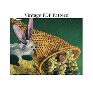 May include: A vintage crochet pattern for a cornucopia filled with grapes and nuts. The pattern features a cute bunny rabbit peeking out from the cornucopia.