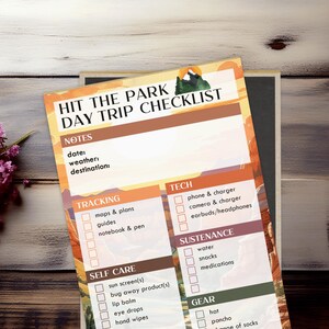 May include: A checklist for a day trip to the park with sections for notes, tracking, tech, sustenance, self care, and gear. The checklist has a mountain scene background with orange, yellow, and brown colors.