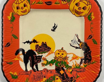 May include: A vintage Halloween paper plate with a black cat, a scarecrow, and pumpkins against a backdrop of a spooky house and a full moon. The plate has a red and orange border with green leaves and vines.