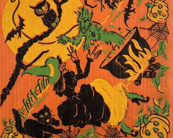 May include: A vintage Halloween-themed illustration with a witch, black cat, owl, and pumpkins. The artwork features a witch in a black dress and hat, with a green-skinned figure and a bat. The background is orange with a yellow moon.