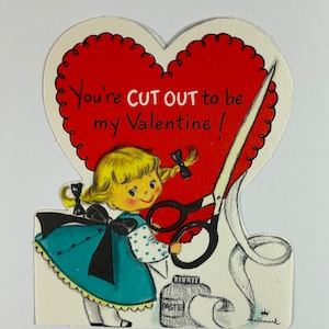 May include: A vintage Valentine's Day card featuring a girl with blonde pigtails holding scissors and cutting out a heart that says "You're CUT OUT to be my Valentine!"
