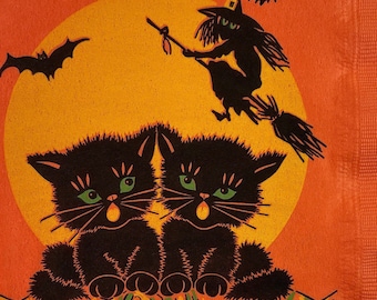 May include: Halloween-themed napkin featuring two black cats with green eyes, a witch on a broom, a bat, and a yellow moon against an orange background. The design has a vintage, retro style, perfect for spooky celebrations.
