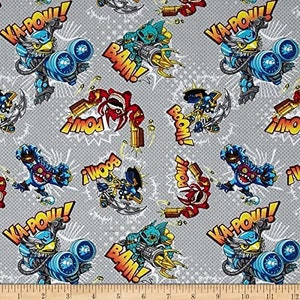 May include: Gray fabric with a repeating pattern of cartoon characters and comic book style words like "Ka-Pow!" and "Bam!" The characters are blue, red, and green and are holding weapons.