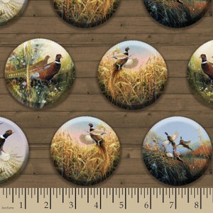 May include: A repeating pattern of circular fabric designs featuring colorful illustrations of pheasants in a field of tall grass. The background is a woodgrain pattern.