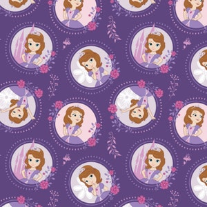 May include: Purple fabric with a repeating pattern of a cartoon princess in a purple dress and crown. The princess is surrounded by flowers and vines. The background is a solid purple.