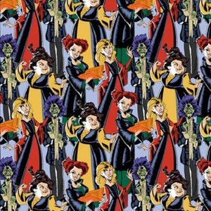 May include: A repeating pattern featuring cartoon illustrations of three witches and a zombie-like figure. The witches wear black, red, and yellow dresses. The zombie figure wears a black suit and has green skin and purple hair. The background is light blue.