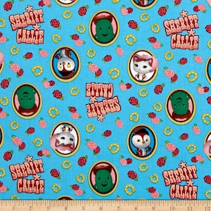 May include: A blue fabric with a repeating pattern of Sheriff Callie's characters. The characters include Sheriff Callie, Toby,  and  the  Deputy  Dogs.  The  fabric  also  includes  pink  roses  and  gold  horseshoes.