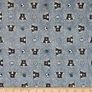 May include: Blue denim fabric with a repeating pattern of white circles containing the text "Earth's Mightiest Avengers" and a black letter "A".  Smaller black circles with various symbols are scattered throughout the fabric.