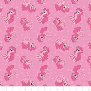 May include: Pink fabric with a repeating pattern of pink ponies with pink manes and tails. The ponies are surrounded by a circle of white stars. The background is a light pink color.