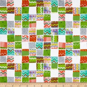 May include: A white fabric with a repeating pattern of colorful squares. Each square has a different geometric design in shades of green, red, brown, blue, and pink.