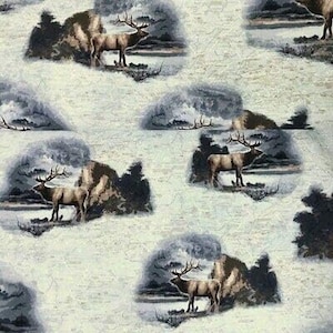 May include: A white fabric with a repeating pattern of elk standing in a forest setting. The elk are brown with large antlers. The forest is depicted in shades of blue and gray.