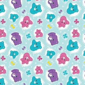 May include: A seamless pattern featuring cartoon bears with different colored fur in pastel blue, pink, and purple. The bears are surrounded by white circles with a floral design and yellow bows. The background is a light blue color.
