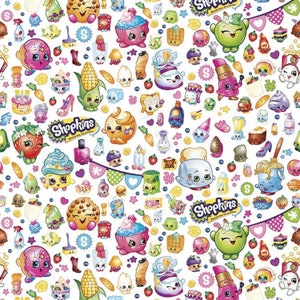 May include: A colorful pattern of Shopkins characters and objects, including a cupcake, a strawberry, a corn cob, a toaster, and a lipstick. The background is white with stars, hearts, and other small details.