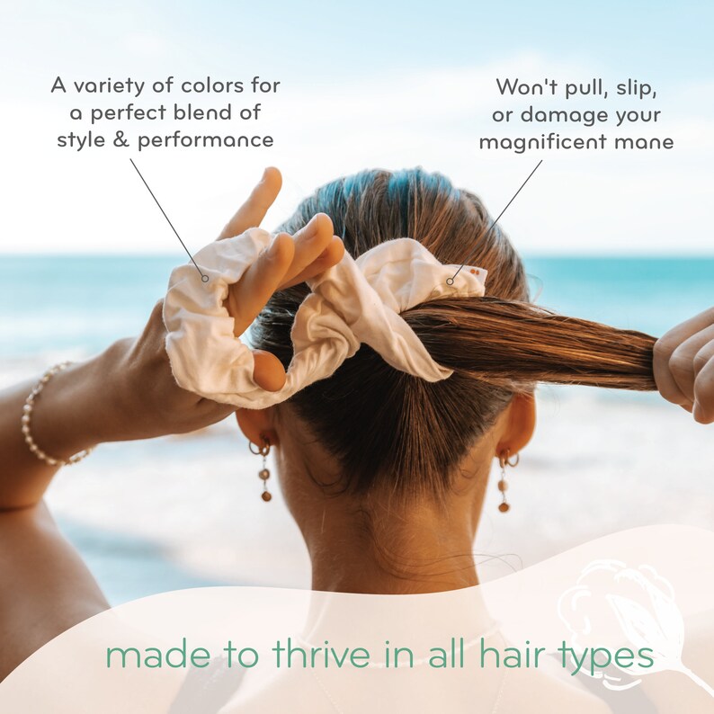 May include: A white scrunchie made of soft fabric is being used to tie up a woman's hair. The scrunchie is designed to be gentle on hair and prevent breakage. The text on the image reads "Won't pull, slip, or damage your magnificent mane".