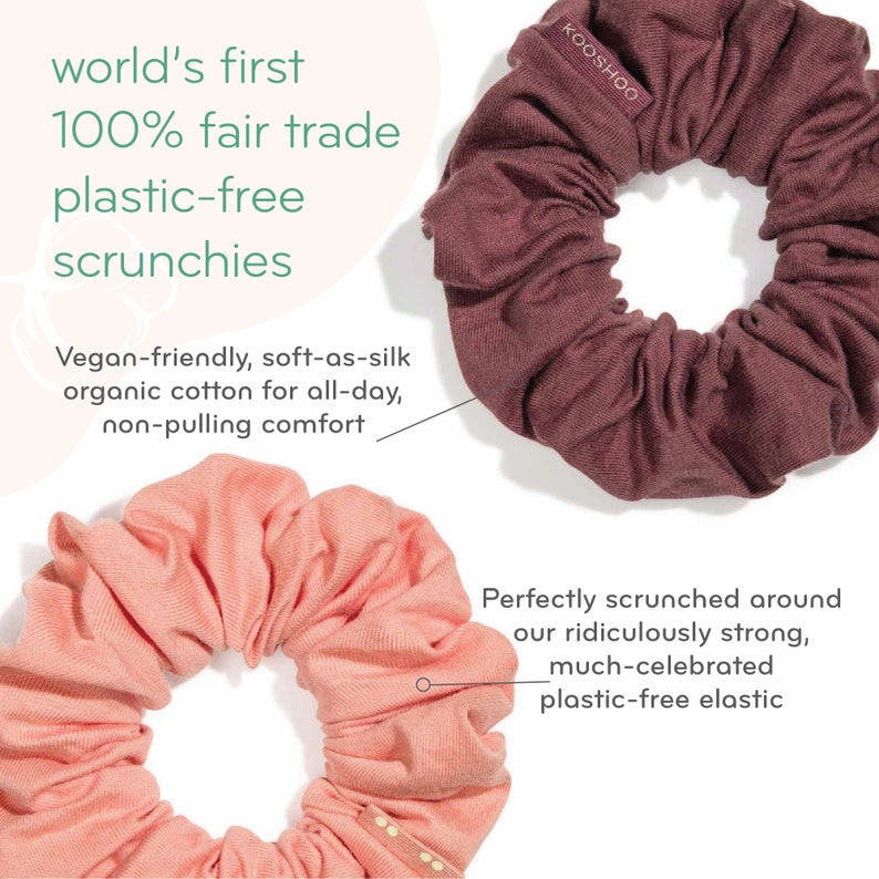 May include: Two fabric scrunchies, one in a light pink color and one in a dark burgundy color. The scrunchies are made from organic cotton and are plastic-free. The text "KOOSHOO" is printed on the burgundy scrunchie.