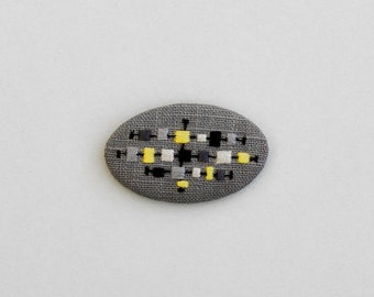 Embroidered brooch art deco pattern