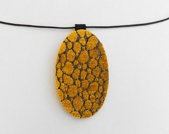 Oversized upholstery necklace, yellow velvet oval pendant