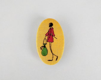 Large yellow brooch, girl embroidery and her handbag