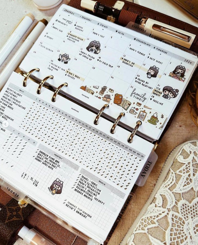 May include: A ring-bound planner open to a January 2024 calendar page with handwritten notes, small cartoon character stickers, and decorative washi tape. The lower section features a daily habit tracker grid and a list of goals with checkmarks.