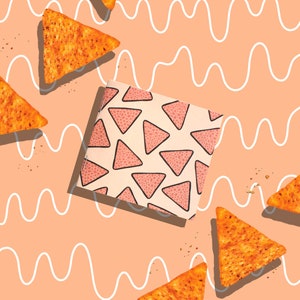 May include: A flat lay of tortilla chips on a peach background with a white wavy pattern. The chips are triangular and have a light brown color with a speckled texture. There is a pink and white patterned square in the center of the image.