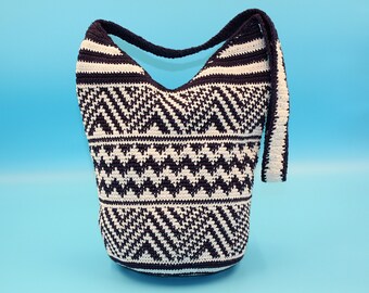 Impressive, chic crossbody crochet purse with a navy blue and white design.