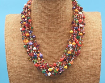 Striking, chic 24” multi-color hand beaded necklace with 12 strands of bright, vibrant, colorful beads
