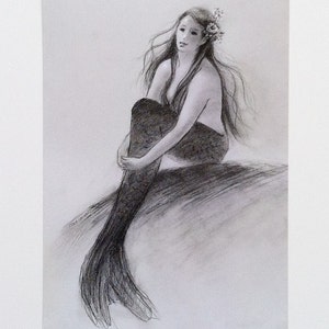 May include: A black and white pencil drawing of a mermaid sitting on a rock. She has long flowing hair and is wearing a flower crown. The drawing is signed "T.ARRENO"
