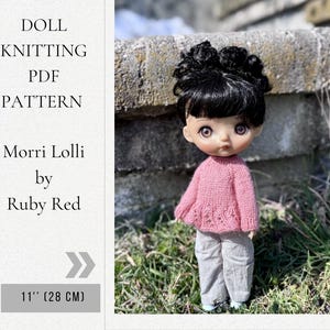 May include: A white ceramic mug with a black handle and the text "But First, Coffee" in a handwritten style. The mug is on a white surface. The mug is approximately 4 inches tall.