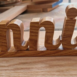 Letrero de madera con nombre