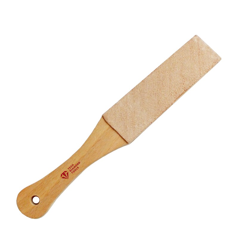 May include: A wooden strop with a leather honing surface. The strop has a red diamond logo with the text "TECH DIAMOND TOOLS".