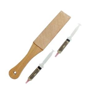 May include: A wooden strop with a leather surface and two syringes filled with diamond compound. The syringes are labelled "Diamond Compound M" and "5 grams".
