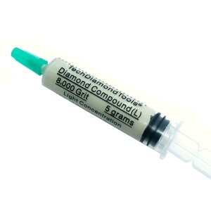 May include: A syringe of TechDiamondTools Diamond Compound (L) 8,000 Grit, 5 grams. The syringe has a white body with black markings and a green tip. The text on the syringe reads "Diamond Compound (L) 8,000 Grit 5 grams Light Concentration."