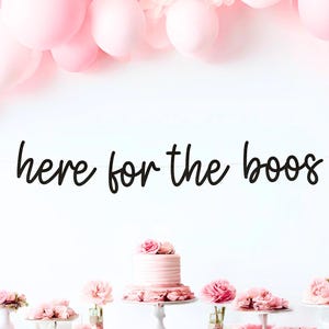 May include: A festive party scene with pink balloons, a banner reading "here for the boos," and a table laden with pink flowers and a cake. The overall theme suggests a celebration or party.