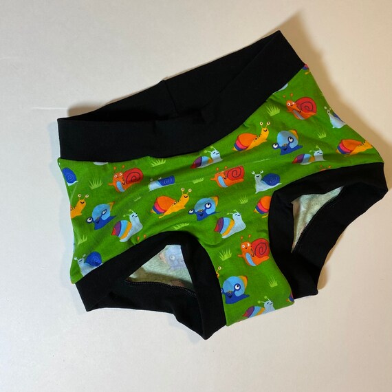 RTS Tuck Buddies 1.0 KIDS - underwear with organic cotton fleece lining in the front for transgender girls - Rainbow snails with black
