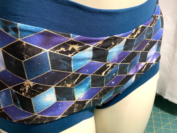 Tuck Buddies 2.0 ADULT - Transfemme / AMAB boyshort style tucking underwear. 1 pair of Tuck Buddies - Teal Isometric Galaxy
